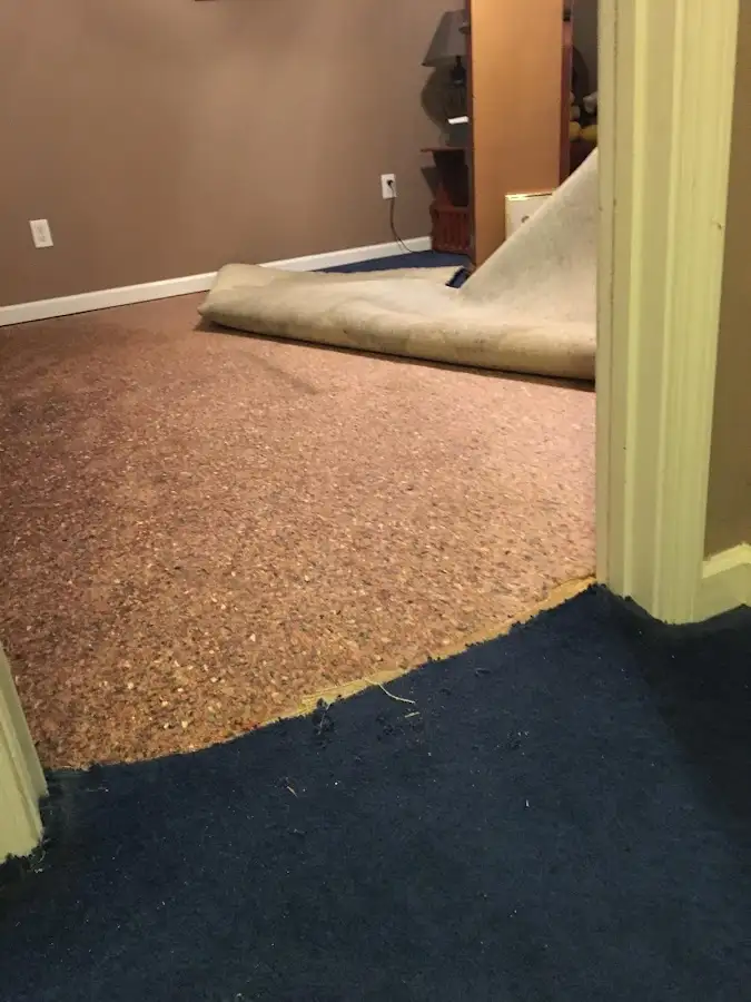 Carpet pad removal revealing water damage during Drying & Dehumidification in Calexico